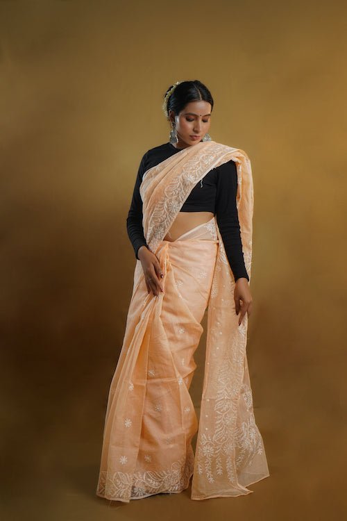 shwet peach kota cotton chikankari saree - Handcrafted Chikankari embroidery, front view. Premium quality fabric.