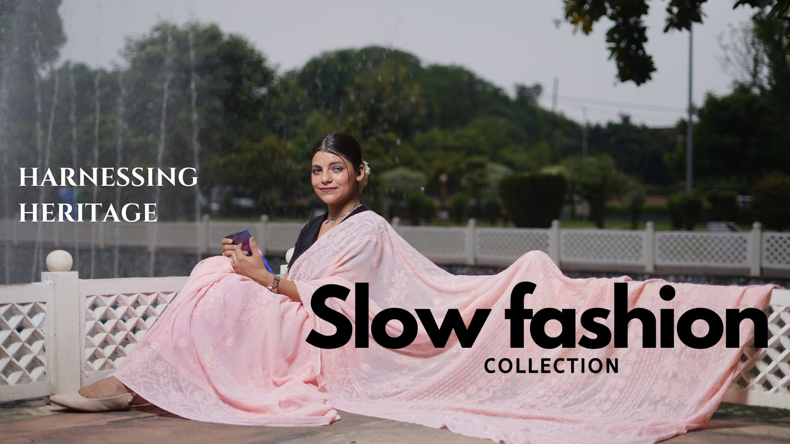 Woman in a pink saree sitting outdoors with 'Slow Fashion' text overlay