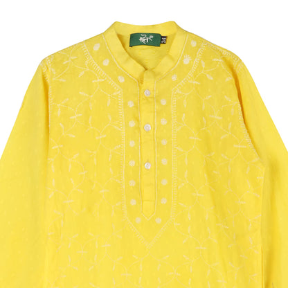 Yellow kurta with white chikankari on a white background