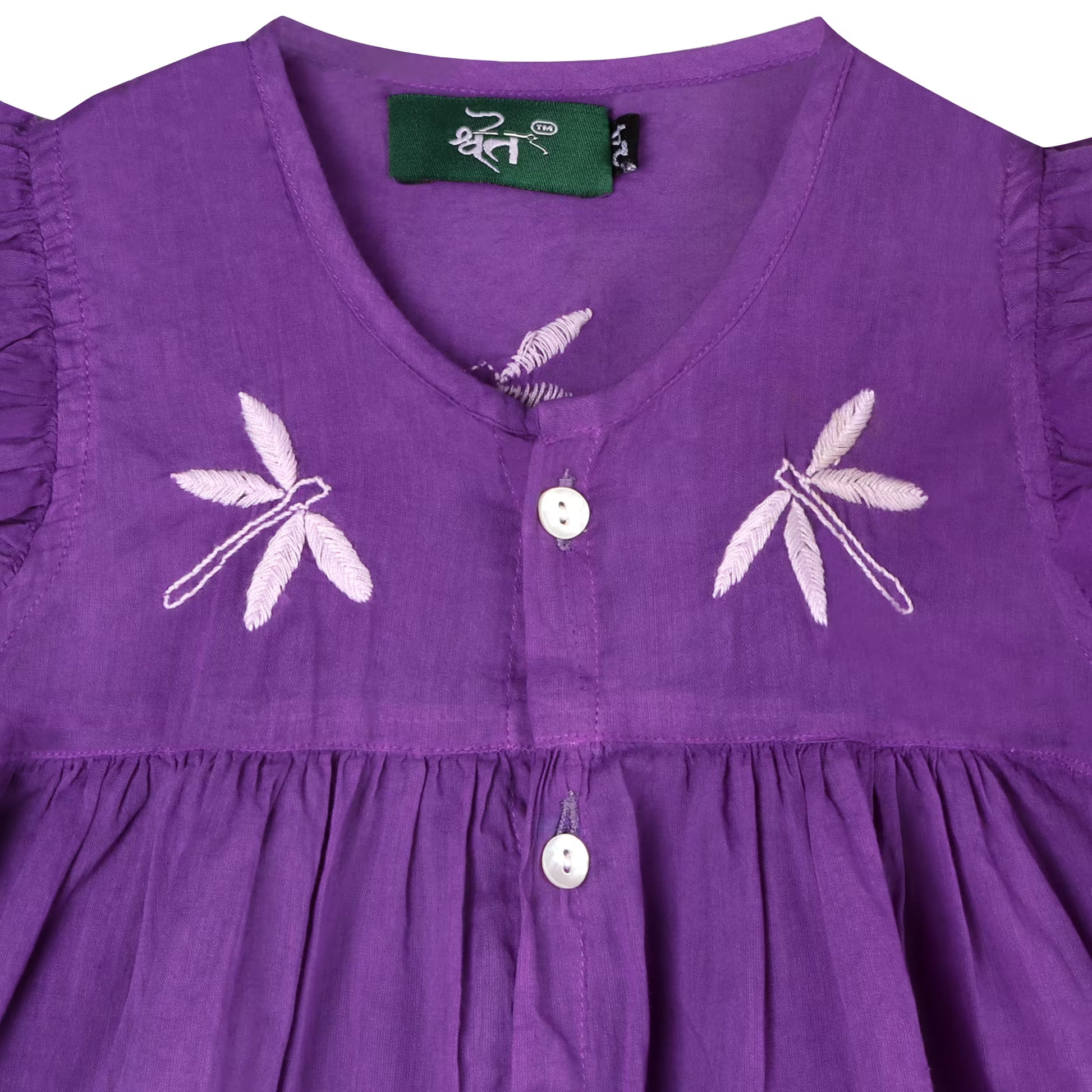 Purple dress with dragonfly embroidery and visible  SHWET  label on a white background