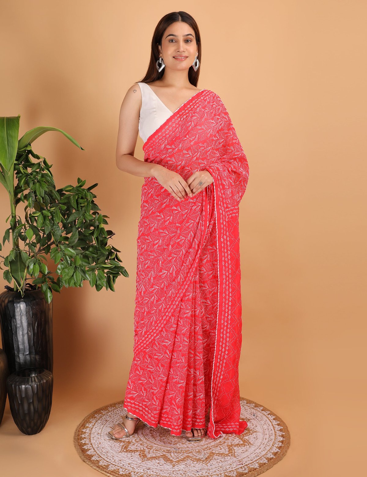 Shwet Red Chikankari Georgette Saree - Handcrafted Chikankari embroidery, close-up detail. Premium quality fabric.