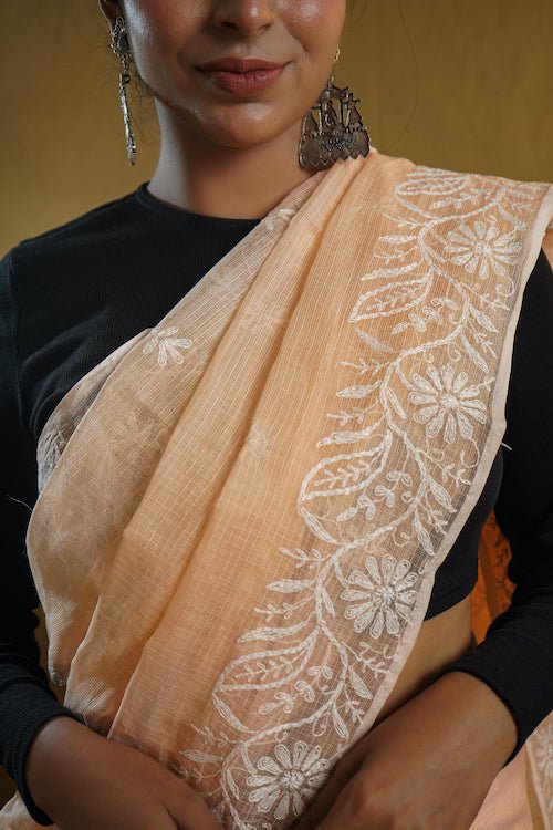 shwet peach kota cotton chikankari saree - Handcrafted Chikankari embroidery, close-up detail. Premium quality fabric.