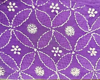 Purple fabric with white floral chikankari and geometric patterns