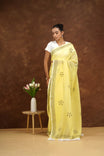 Woman in a yellow saree with a white background
