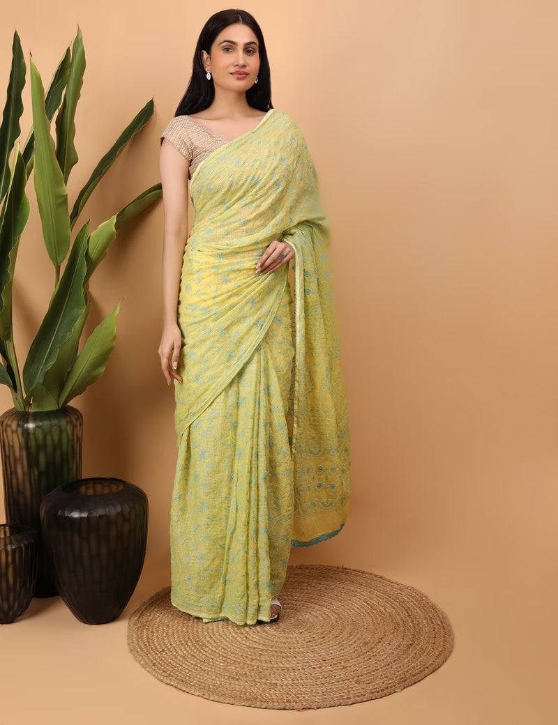Yellow and green hand embroidered chikankari saree standing pose 